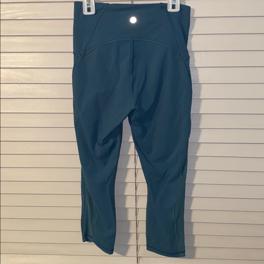 Teal pair of lululemon cropped leggings
